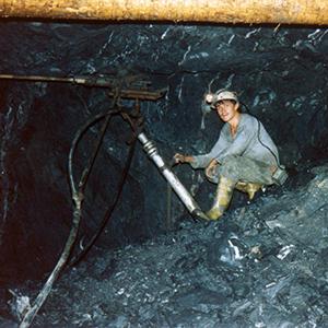 Drilling into a uraniferous ore layer. Especially during the early years of the Wismut mine, proper protection from radioactive dust and radon gas was not provided to the miners. 