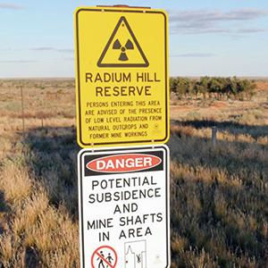 While uranium mining was halted at Radium Hill in 1961 and no more radioactive waste has been deposited there since 1998, the entire site remains a radioactive danger zone, with tailings and waste rock not properly secured from erosion and dispersion.