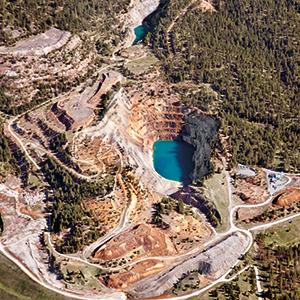 Midnite Mine, the only open-pit uranium mine in the northwestern United States, produced fissile material for the U.S. nuclear weapons program. A clean-up plan was not drafted until 30 years after the mine was decommissioned.
